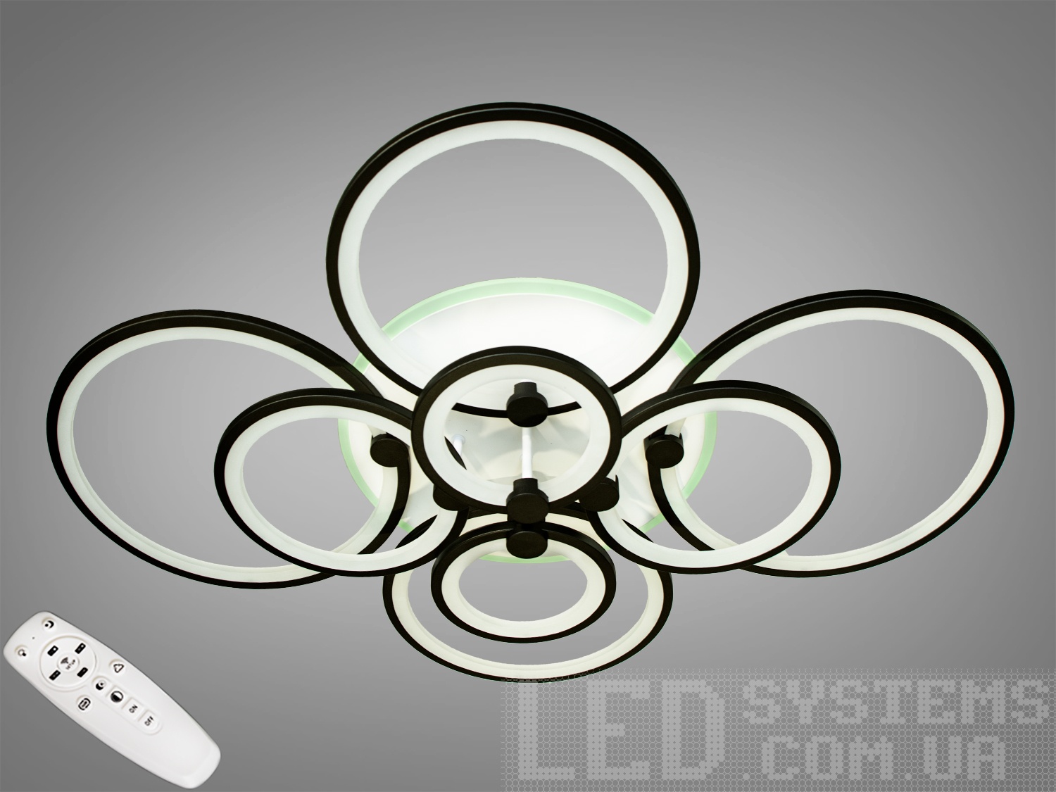 Світлодіодна люстра має декілька режимів: холодний 6400К, нейтральний 4500К, теплий 2700К, LED підсвічування, поєднаний режим - будь основне світло плюс світлодіодне підсвічування - все залежить від вашого настрою.
Стельовий світильник має електронний димер, що дозволяє регулювати яскравість люстри від 5% до 100% за допомогою пульта, який поставляється разом з люстрою.
На додаток до стандартних режимів світлодіодним люстри, доданий режим кольорового підсвічування. Люстра здатна наповнити кімнату приємним кольоровим переливом - за 2 хвилини в режимі підсвічування люстра проходить всі кольори веселки. Світлодіодні люстри цієї серії стали ідеальним світильником в дитячу. Відсутність скляних частин і припотолочная компоновка люстри дозволяє пережити їй будь-яке дитяче веселощі, а приємний багатобарвний світ можна сміливо залишати як нічник.
Люстра світить яскраво, але не сліпить за рахунок матеріалу - акрилу, до того ж цей матеріал дуже міцний - його важко пошкодити.
Легка вага, невелика висота, пульт, димер, додаткове підсвічування - вам обов'язково сподобаються наші люстри.